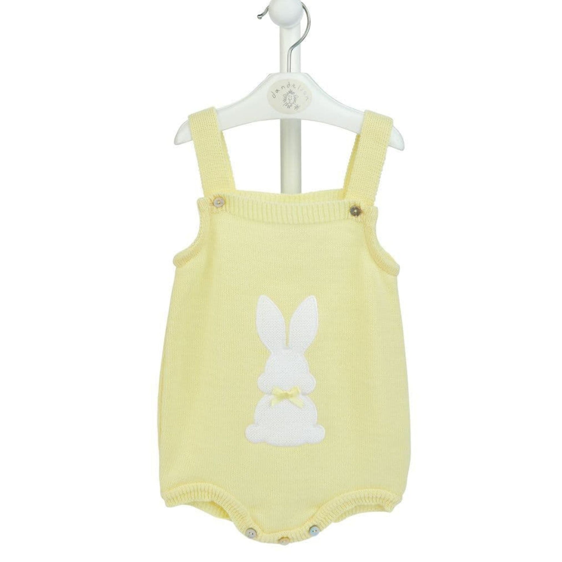 Yellow baby romper with bunny design on a white background