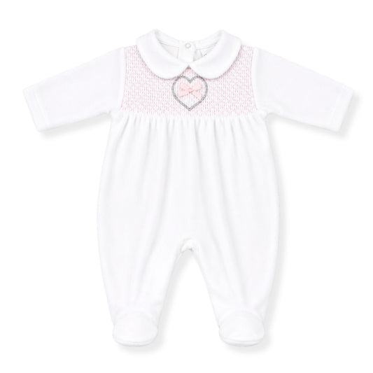 White baby girl smocked babygrow with pink detailing, Peter Pan collar and heart bow embroidery, traditional newborn sleepsuit
