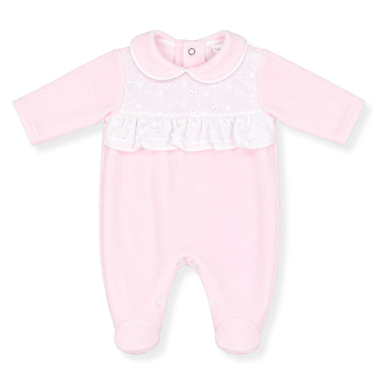 Pink babygrow with white ruffle on a white background