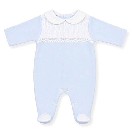 Light blue baby sleepsuit with white trim on a white background