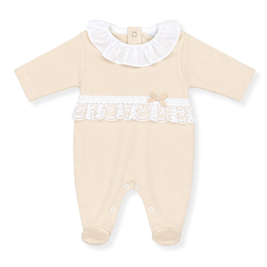 Beige baby girl sleepsuit with white lace details on a white background
