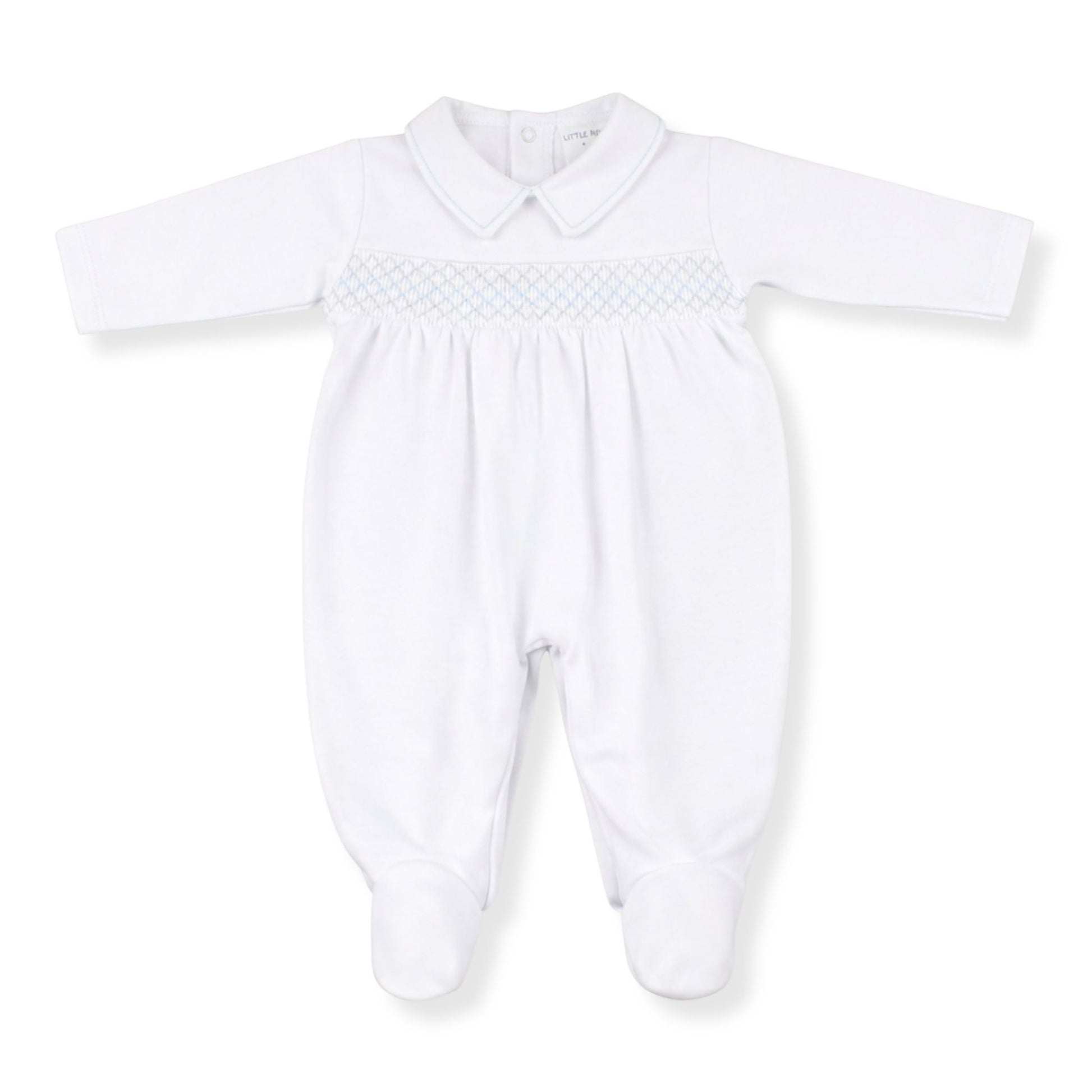 White baby grow with smocked details on a white 