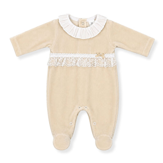 Beige baby grow with white lace details on a white background