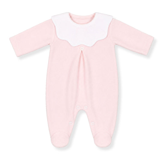 Pink baby sleepsuit / babygrow with a white collar on a white background