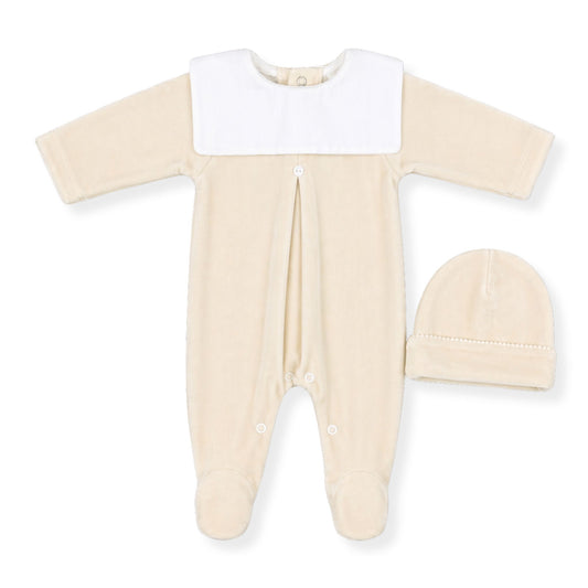 Beige baby sleepsuit with white collar and matching hat on a white background