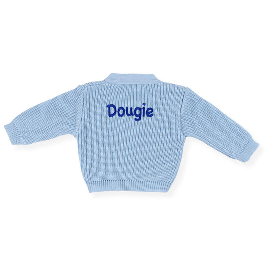 Light blue baby sweater with 'Dougie' embroidered on the back against a white background
