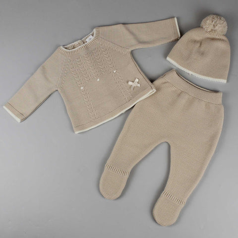 beige three piece knitted outfit with jumper trousers and hat