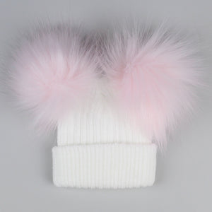 white and pink pom pom hat