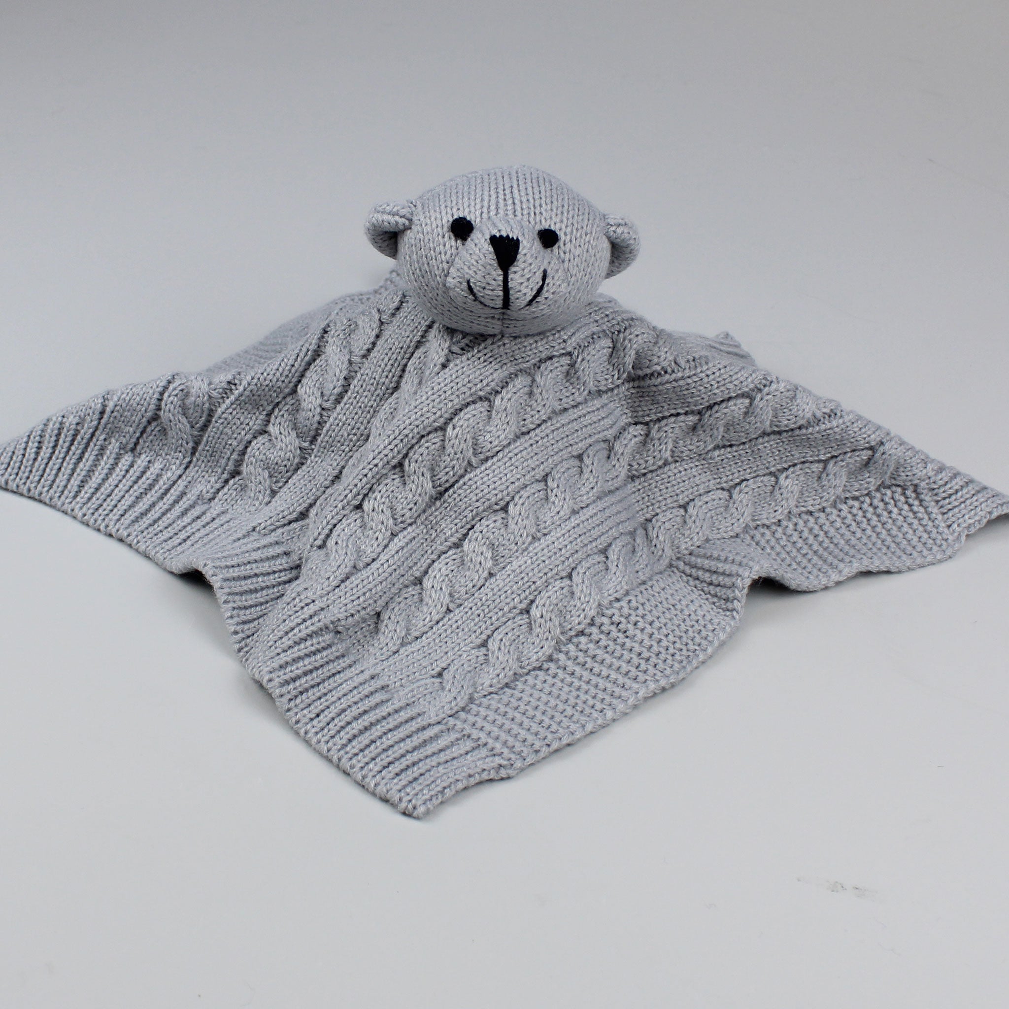 grey knitted comforter
