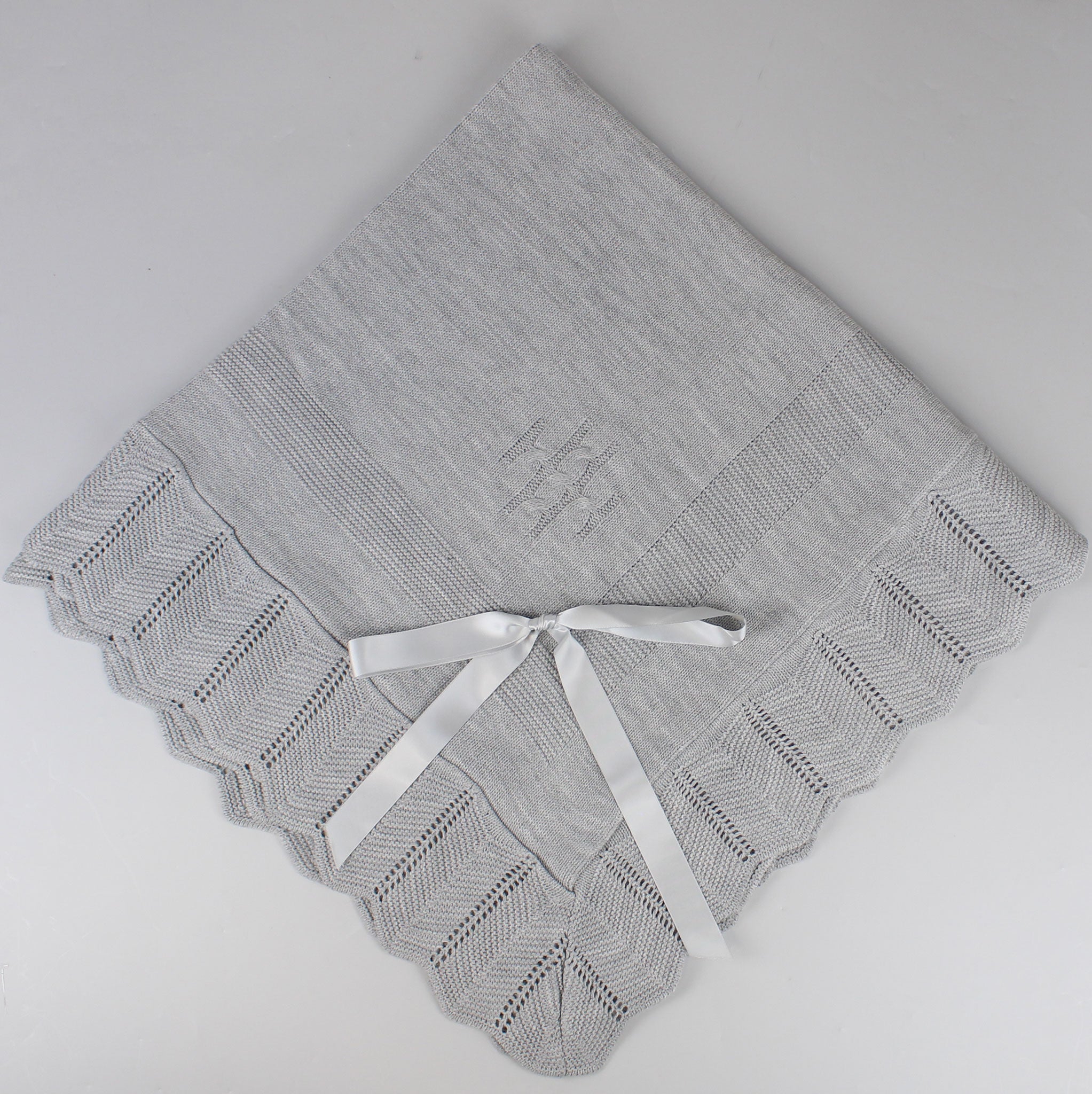 grey knitted shawl with bow