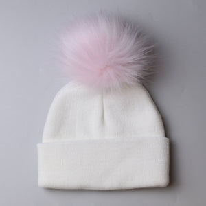 baby girls pink and white pom hat two to six years