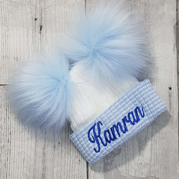 personalised first size baby hat with two pom poms