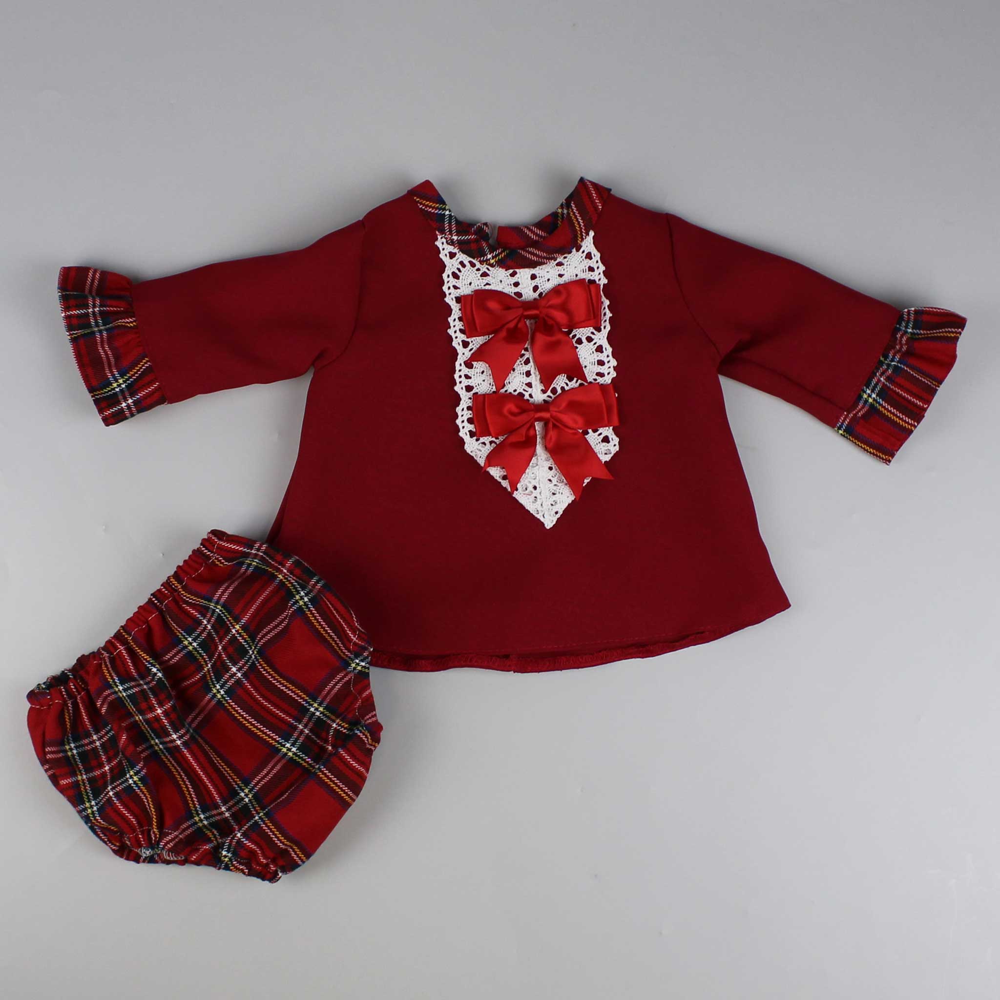 red and white two two piece outfit with two bows