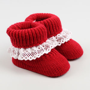 red knitted booties baby