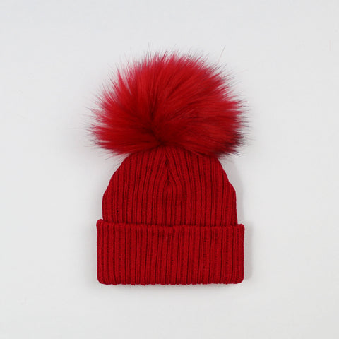 red knitted pom pom hat