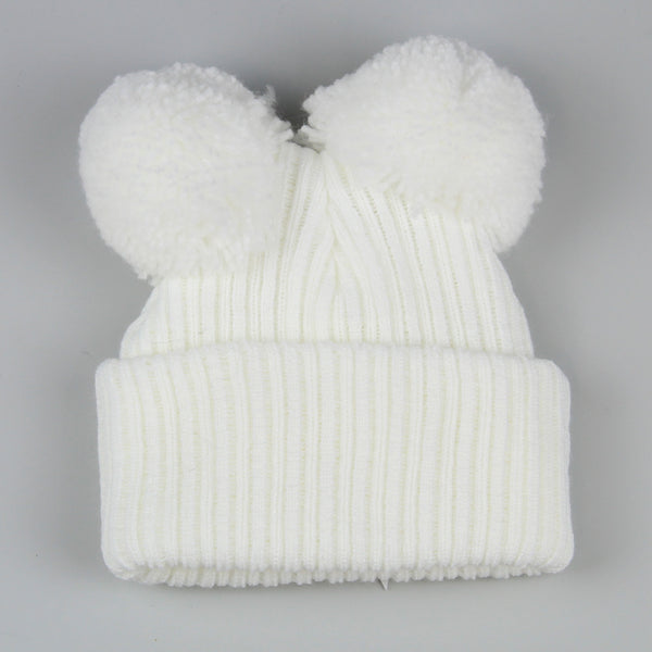 back of baby white pom hat with bow