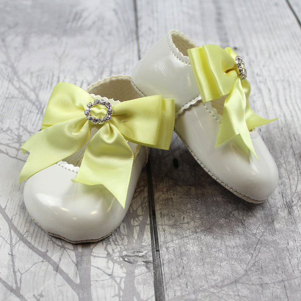 girls white and yellow bow diamante shoes